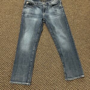 Light Blue Straight Leg Jeans with Distressed Wash
